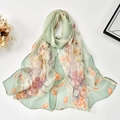 Detailed view of light green floral georgette scarf with vibrant blossom patterns - 160x50cm / Light Green