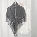 Close-up of dark grey hollow knit shawl featuring elegant long tassels and soft texture - Dark Gray