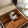 Macro shot of silver-tone open ring with stacked cubic zirconia in a jewelry box - Half Open Inlaid Rhinestone Ring / Silver