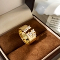 Macro shot of gold-plated wide open ring with sparkling cubic zirconia inlay details - Half Open Inlaid Rhinestone Ring / Gold