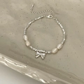 Elegant beaded silver bracelet with freshwater pearls and a central metal bow pendant - Silver Freshwater Pearl Bowknot Bracelet (B-368)
