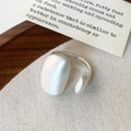 Macro detail of silver pebble open ring featuring a fine brushed matte metallic finish - Silver