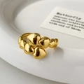 Macro shot of gold heart ring with polished 3D heart shapes on a ceramic plate - Heart Shaped Open (Gold) / Gold