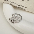 Macro detail of silver star opening ring featuring sparkling zircon pavé craftsmanship - Silver