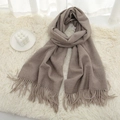 Deep camel knitted scarf for winter with fringe details on a cozy white plush background - Light Khaki