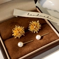 Macro shot of gold firework zircon studs and elegant white pearl earrings on brown velvet - Gold Firework Four-Piece Stud Earrings Set
