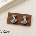 Macro view of silver hammered texture earrings with a row of inlaid white pearls - Hammered Twisted Pearl Silver (A-701)