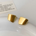 Polished gold geometric square stud earrings with mirror finish on a decorative tray - Gold Small Stud Earrings (A-1576)