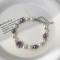 Detailed shot of pearl necklace with purple gemstone charm and lobster clasp closure - Purple and White (Bracelet)