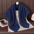Detail view of navy blue cotton linen scarf draped with a beige silk top and accessories - 90cmx90cm / Navy Blue
