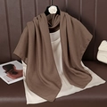 Detail view of a premium dark brown solid linen scarf draped elegantly on a camisole top - 90cmx90cm / Coffee