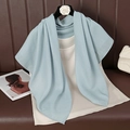 Light blue cotton linen scarf draped on a black hanger over a leather surface - 90cmx90cm / Sky Blue