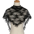 Elegant black lace triangle shawl with floral patterns and fringe details on a mannequin - Black