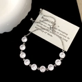 Detailed view of adjustable silver box chain bracelet with sparkling round zircons - Zirconia Adjustable Bracelet