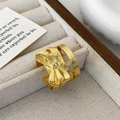 Detailed view of textured gold bow ring with sparkling zircon in an elegant jewelry box - Brushed Texture (Gold) / Gold Bowknot Ring