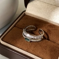 Macro detail of silver double-layer ring with green emerald-cut stone and pavé zircons - Silver Peacock Green Zircon Double Layer Ring