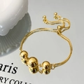 Detail of gold box chain bracelet with three polished beads and adjustable slider clasp - Gold Ball Bracelet