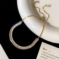 Close-up van verstelbare 18K gouden armband met rechthoekige zirkoon en schuifsluiting - Volledige Zirkonia Verstelbare Schuifarmband