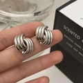 Close-up of spiral textured silver metal earrings with a polished mirror finish - Shell Spiral Texture Style (A-883)