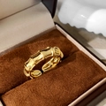 Detailed close-up of a golden bamboo joint ring resting in a premium velvet gift box - Polished Bamboo Style (C-89)