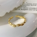 Detailed view of a golden olive-shaped beaded adjustable ring on a minimalist background - Olive Bead Open Style / Gold