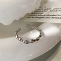 Macro detail of silver adjustable ring with bead design on minimalist white ceramic - Olive Bead Open Style / Silver