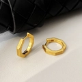 Macro shot of gold hexagonal earrings showing vertical texture and secure clasp closure - Gold Hexagonal Striped Ear Cuffs