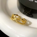 Macro shot of gold chain texture ring with interwoven smooth and rope twist design - Shiny Gold Double Layer Ring