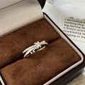 Macro shot of gold-plated crossover ring with zircon inlay in a velvet jewelry box - C-116 Cross Star Style (C-116) / White