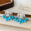 Macro view of fountain tassel earrings with blue beads and cubic zirconia details - Silver Blue Natural Stone Tassel Stud Earrings