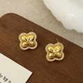 Detailed close-up of clover studs featuring quilted gold texture and zircon pavé edges - Clover Flower Studs / Gold