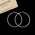 Detailed view of silver matte hoop earrings with hook closure on a dark minimal background - Silver 6cm Hoop