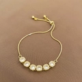 Elegant adjustable gold bracelet featuring six square cubic zirconia stones and snake chain - Gold Bracelet
