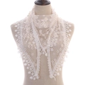 Triangle lace scarf with yellow floral embroidery and tassel details on white mesh - White
