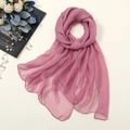 Detail of dusty pink chiffon scarf showing fine rolled edges and semi-transparent texture - Leather Purple