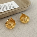 Detail of gold woven mesh hoop earrings on a vintage card and rustic fabric background - Gold Large