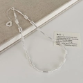 Dettaglio di catena ritorta argento con perle bianche e ciondolo a perla a cuore - Collana / Argento