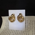 Close-up of interlocking gold geometric hoop earrings on a decorative display card - Multi-layer Interlocked Geometric Style (A-276 Small)
