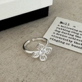 Anello aperto minimalista in argento con fiore traforato e zircone scintillante - Anello Aperto a Fiore Svuotato Argento