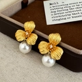 Macro view of matte gold petal earrings with white pearl detail and vintage texture - Gold Flower Single Large Pearl Style