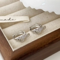 Elegant silver heart-shaped hoop earrings with crystals in a wooden jewelry box - Silver Heart Buckle