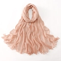Detail of peach pink textured hijab fabric with pleated wrinkles and fringe edges - Light Pink / 180cm x 70cm
