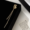 Detail of gold-plated double-layer ear cuff with zircon tassels on black velvet - Gold Tassel Ear Cuff