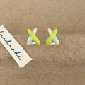 Detail view of X-shaped cross earrings with green enamel and sparkling zircon pavé - Green