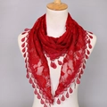 Macro detail of red lace triangle scarf with floral patterns and teardrop pendants - Burgundy