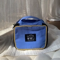Blue and yellow nylon travel cosmetic bag featuring cartoon graphics and top handle - Blue