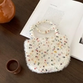 Close-up of a white plush woven handbag with colorful spots on a wooden table - Multicolor Dots