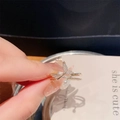 Elegant gold fishtail ring with micro-set zircon and a white pearl accent - Gold