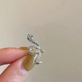 Silver snake ear cuff with sparkling zircon inlay and green gemstone eyes for women - Snake / Silver
