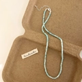 Macro detail of sky blue beaded necklace with handmade label and adjustable silver clasp - Green Shell Bead Necklace (B-653)